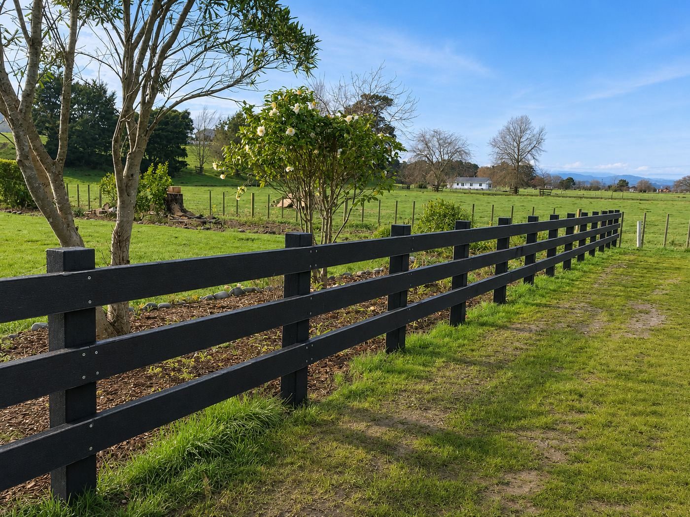 A fence line built from recycled posts, where a Sign Central board ends up